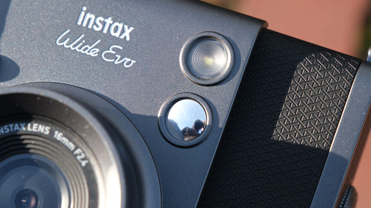 Close up of the flash and selfie mirror on a Fujifilm Instax Wide Evo