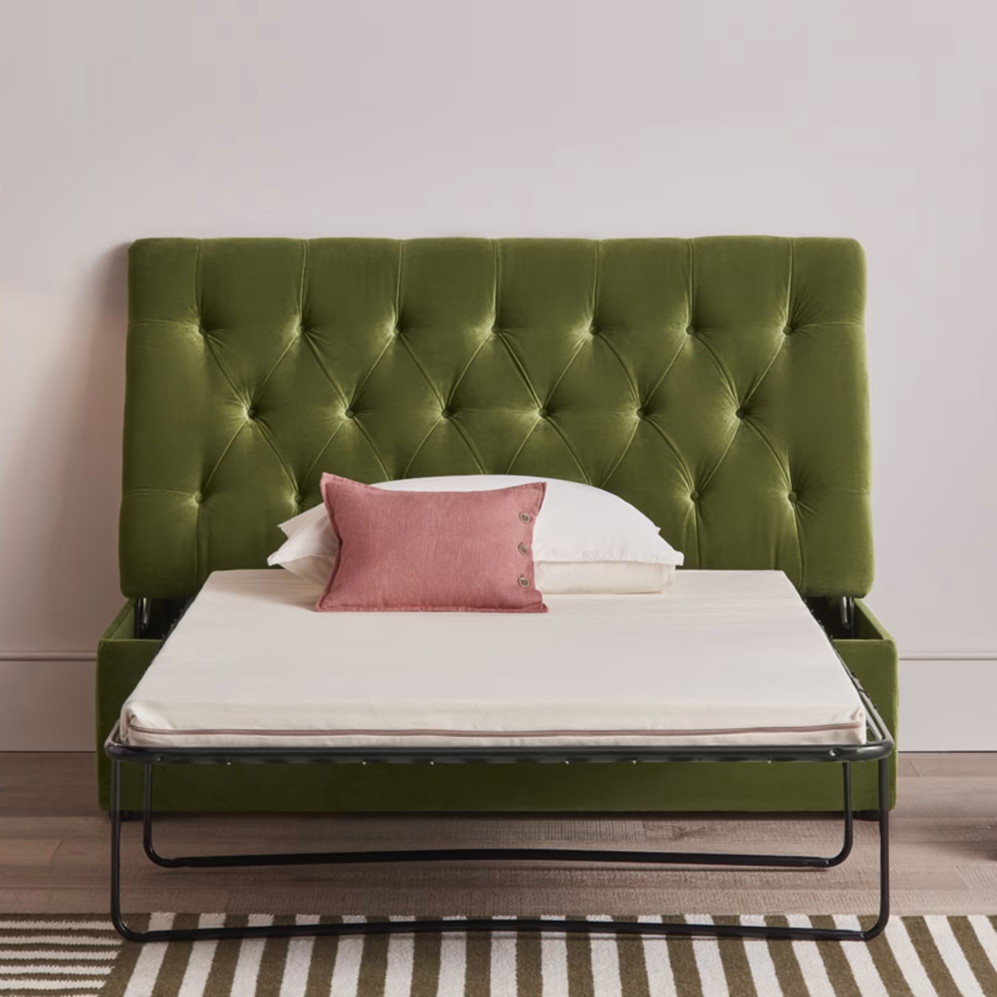 Loaf 'Bed-in-button' upholstered in green velvet fabric