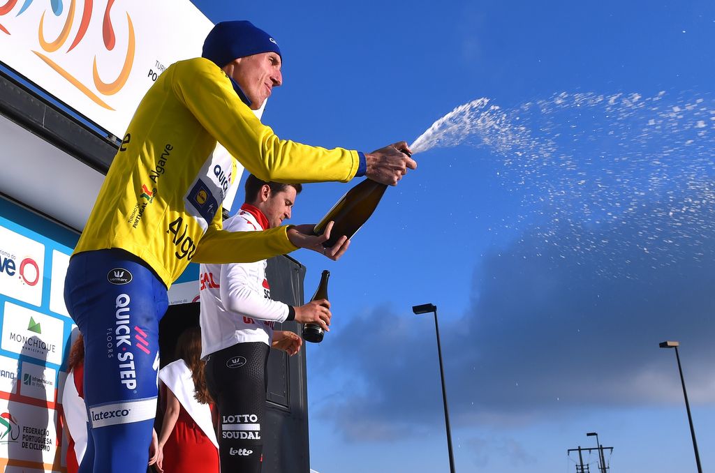 Race leader Dan Martin sprays the cava