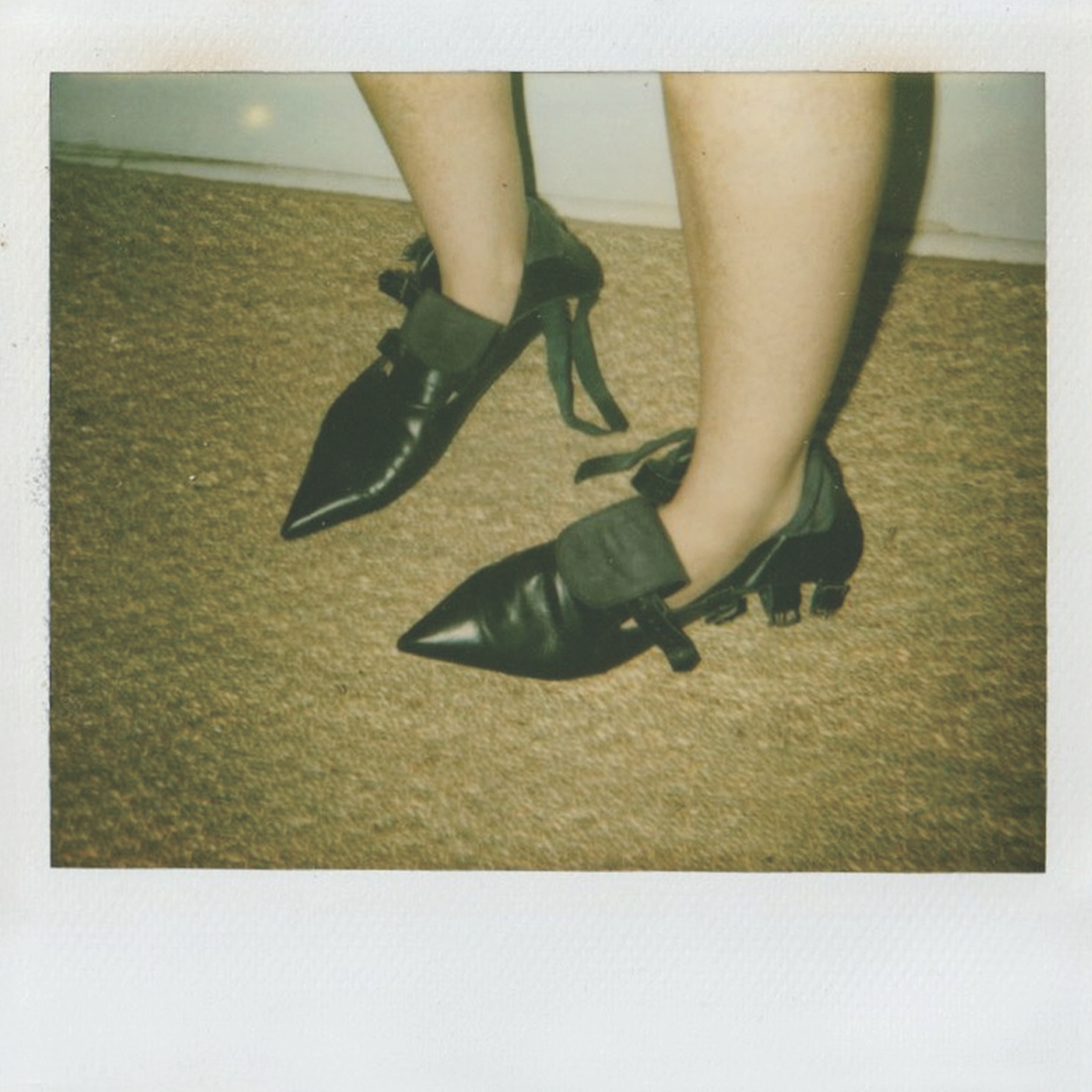 womens feet in black shoes