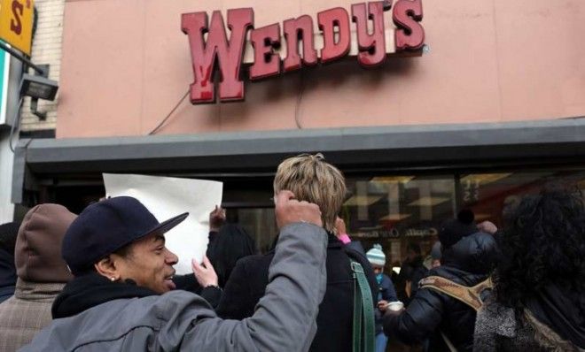 Protesters, many of whom are Wendy&amp;#039;s employees, demonstrate outside a New York City location on Nov. 29.