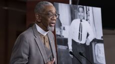 Rep. Bobby Rush stands in front of a picture of Emmett Till.