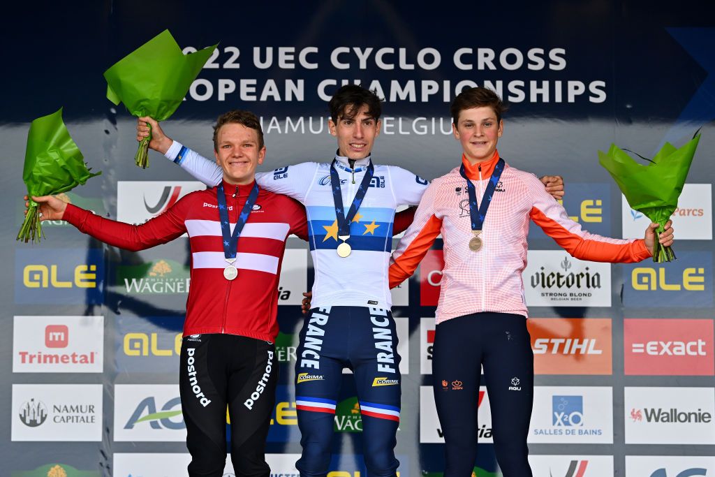 NAMUR BELGIUM NOVEMBER 06 LR Silver medalist Daniel Nielsen Weis of Denmark gold medalist Lo Bisiaux of France and bronze medalist Guus Van Den Eijnden of The Netherlands pose on the podium during the medal ceremony after the 20th UEC European Cyclocross Championships 2022 Mens Junior EuroCross22 on November 06 2022 in Namur Belgium Photo by Luc ClaessenGetty Images