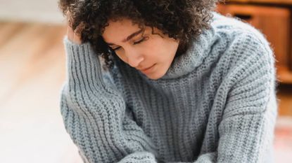 Woman looking stressed, sleep & wellness tips