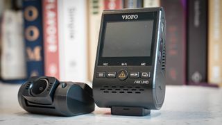 Viofo A129 Pro Duo front and rear dashcams on a bookshelf