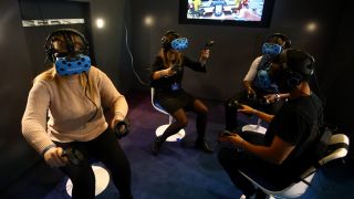 Four people playing a VR game