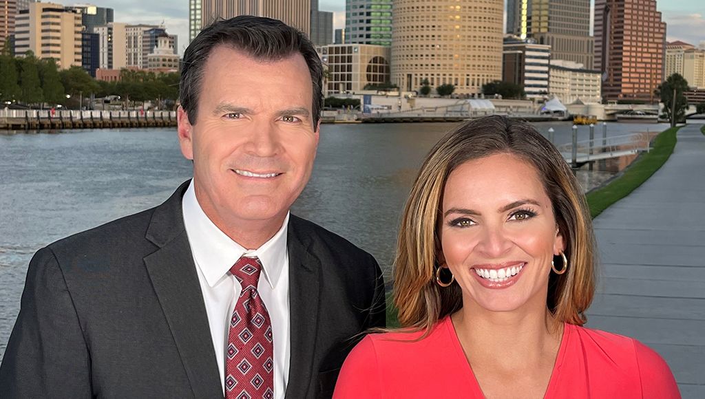 WTVT/Fox 13 anchors Mark Wilson and Allie Corey at the Tampa Riverwalk. 