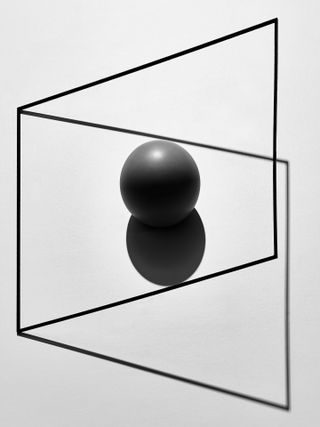 A black ball in a vertically skewed square.