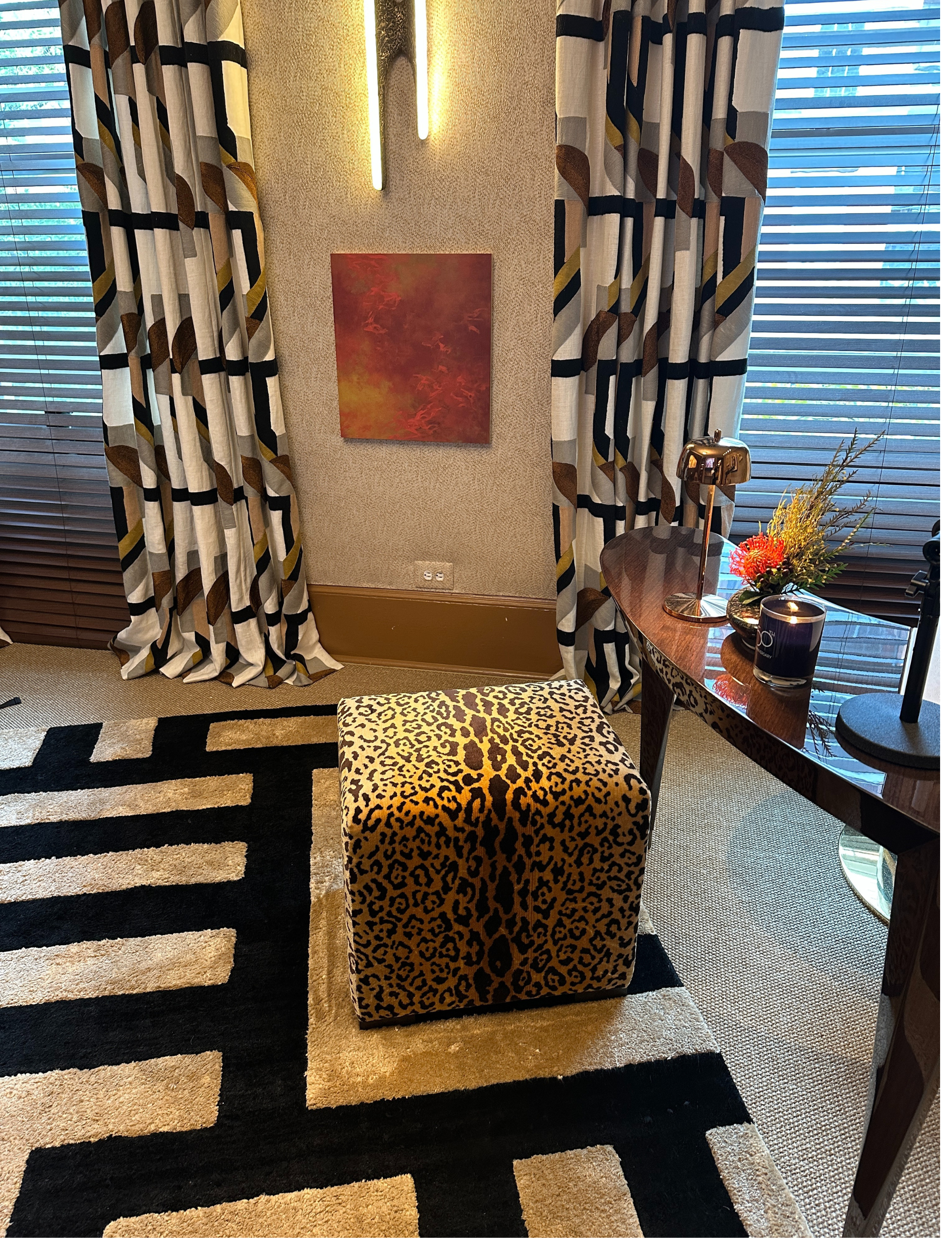 Leopard ottoman pictured inside of a pattern-drenched home office