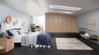 Bedroom in loft conversion with wooden wardrobe and tall window