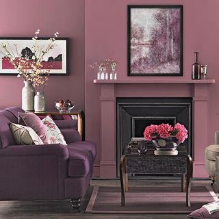 living room with plum colour and flower pot on table