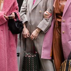 Three attendees at fashion week during New York Fashion Week Autumn Winter