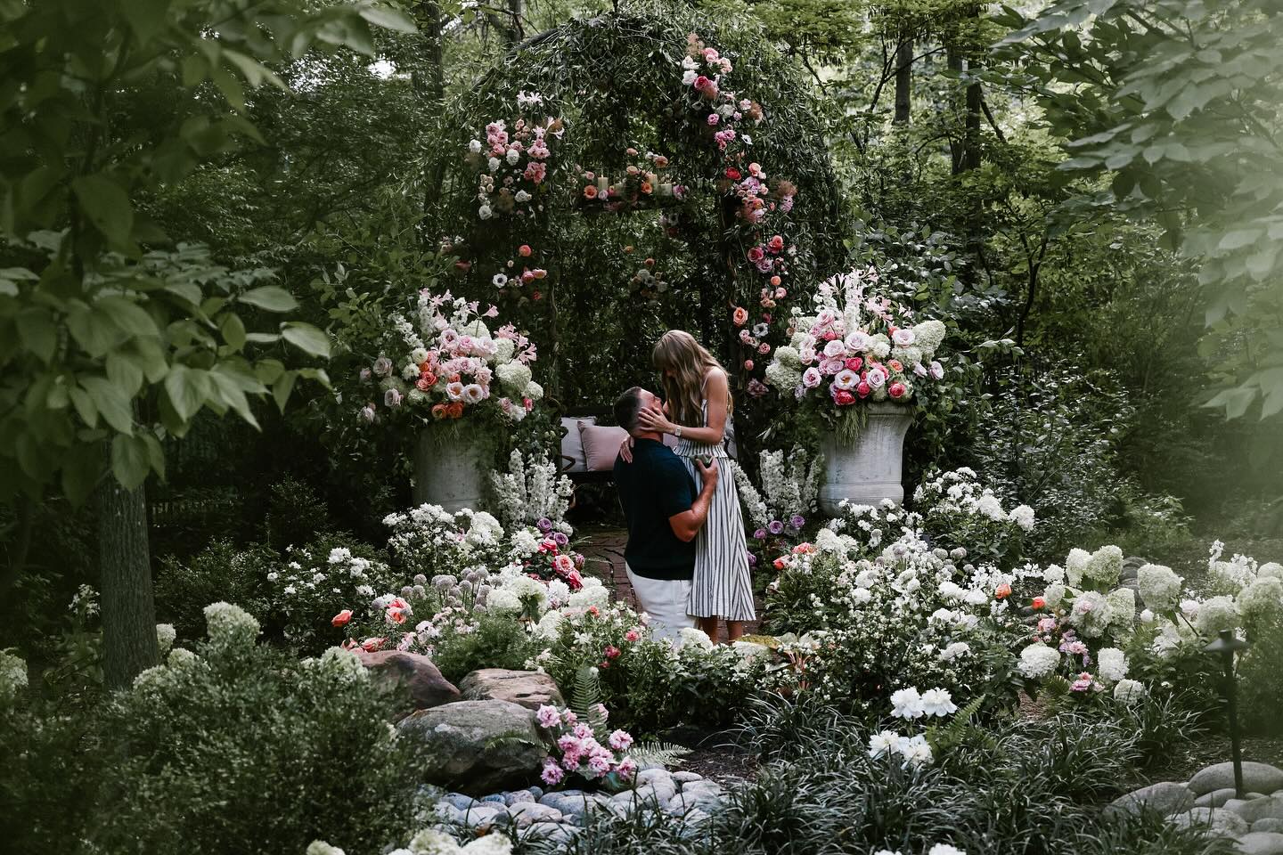 Taylor Swift and Travis Kelce getting engaged in a botanical garden