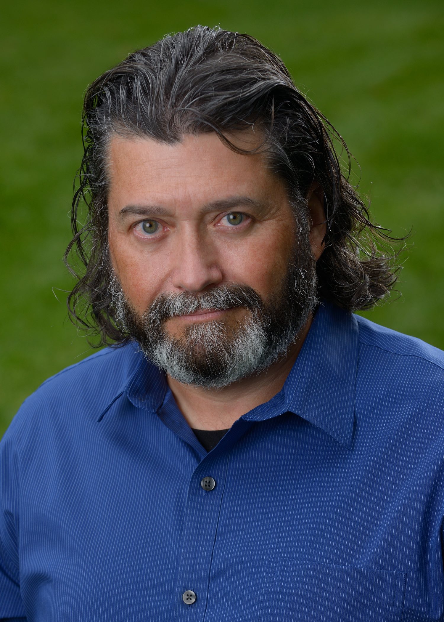 The Blackmagic Design InfoComm Impulse logo and headshot of Bob Caniglia.