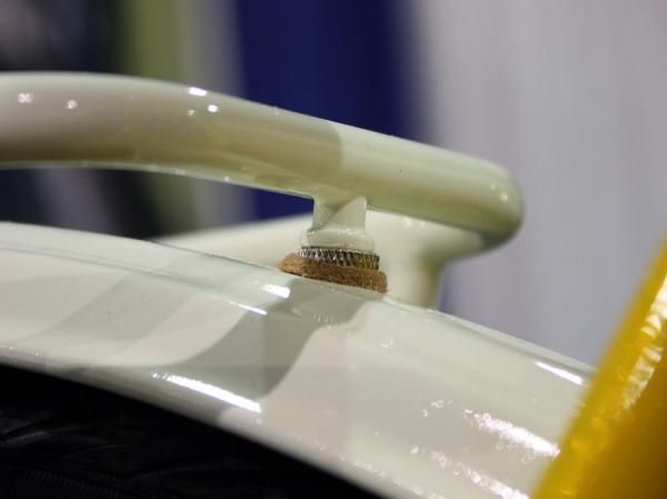 A small leather washer is a nice way to keep parts from rubbing.