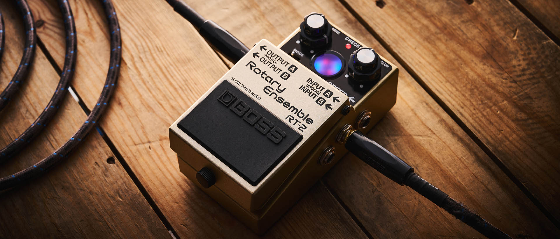 The Boss RT-2 Rotary Ensemble pictured in close-up against a wooden floor.