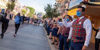 Main Street cast members greeting guests at Disneyland