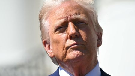 US President Donald Trump speaks during a photo opportunity with autoracing officials and champions on the South Portico of the White House on April 9, 2025, in Washington, DC. US President Donald Trump abruptly backed down Wednesday in his global trade war with a 90 day tariff pause for most countries -- but slapped even more levies against China in what has become a brutal duel between the world's two largest economies. (Photo by SAUL LOEB / AFP) (Photo by SAUL LOEB/AFP via Getty Images) 