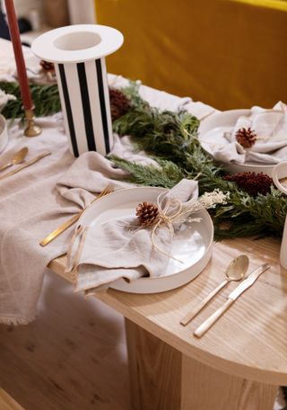 A Christmas table with napkin decor