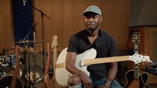 Isaiah Sharkey with Ritter's Princess Isabella guitar