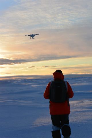 Guy Williams launching a Phantom 2 Vision+ quadcopter in the Arctic.