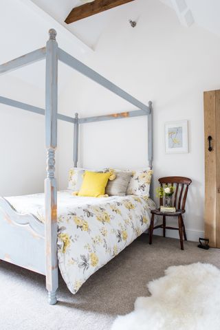 bedroom with upcycled pine four-poster bed
