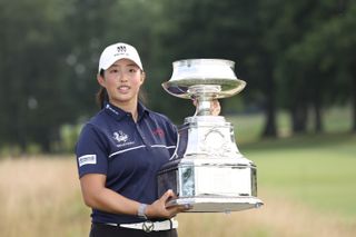 Ruoning Yin holds the KPMG Women's PGA Championship trophy in 2023