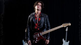 Donner Seeker Series electric guitar held by a fashion model