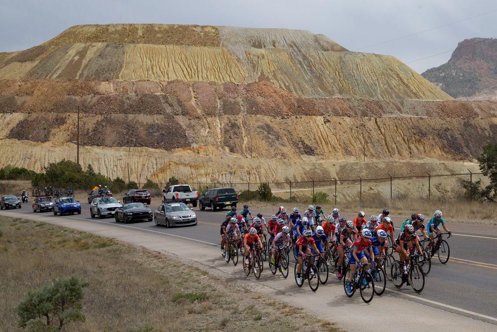 The peloton goes by the massive Santa Rita mine during stage 2