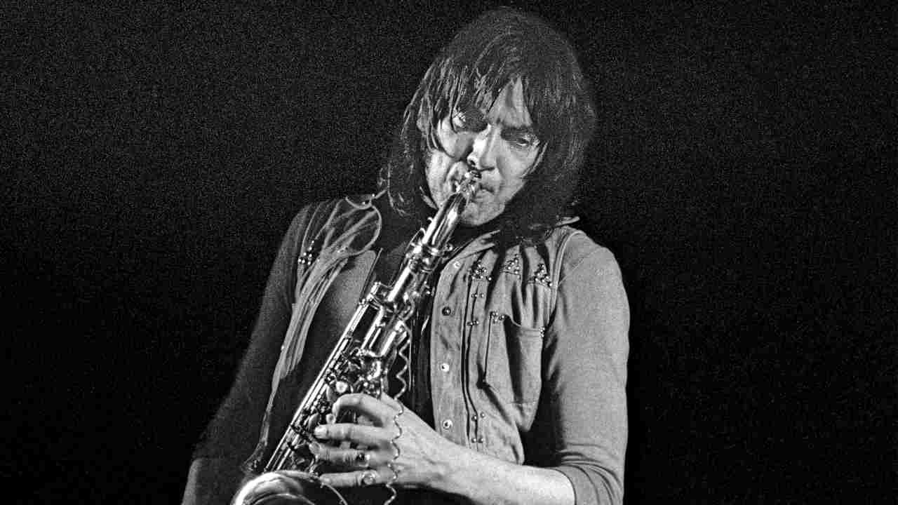 Chris Wood performing onstage in 1973