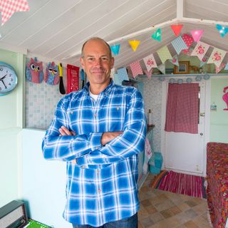 journalist phil spencer in attic room with wall clock
