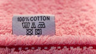 A care label on a pink towel