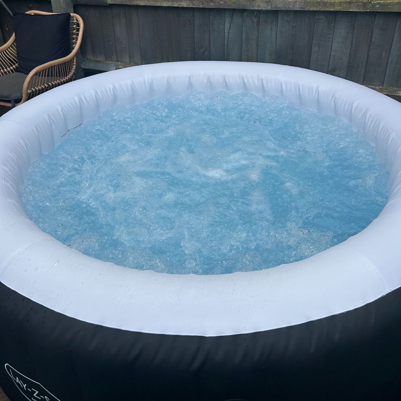 Navy and white Lay-Z-Spa Miami on with water bubbling