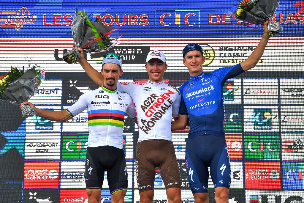 PLOUAY FRANCE AUGUST 29 LR Julian Alaphilippe of France and Team Deceuninck QuickStep Benoit Cosnefroy of France and Ag2R Citroen Team and Mikkel Honor of Denmark and Team Deceuninck QuickStep celebrate winning on the podium ceremony after the 85th Bretagne Classic OuestFrance 2021 a 251km race from Plouay to Plouay OuestFrance on August 29 2021 in Plouay France Photo by Luc ClaessenGetty Images