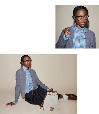 Demi Singleton poses for photo wearing gray cardigan, checkered button-down shirt, navy midi skirt, brown loafers, and a white bucket bag.