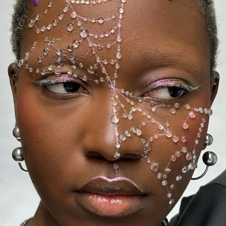 MUA Lynda Florae wearing spiderweb makeup.