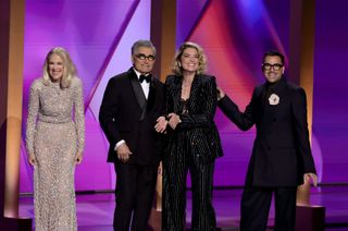 Catherine O'Hara, Eugene Levy, Annie Murphy, and Dan Levy speak onstage during the 76th Primetime Emmy Awards at Peacock Theater on September 15, 2024 in Los Angeles, California