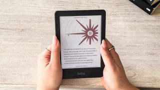 A person holding the Kobo Clara Colour ereader