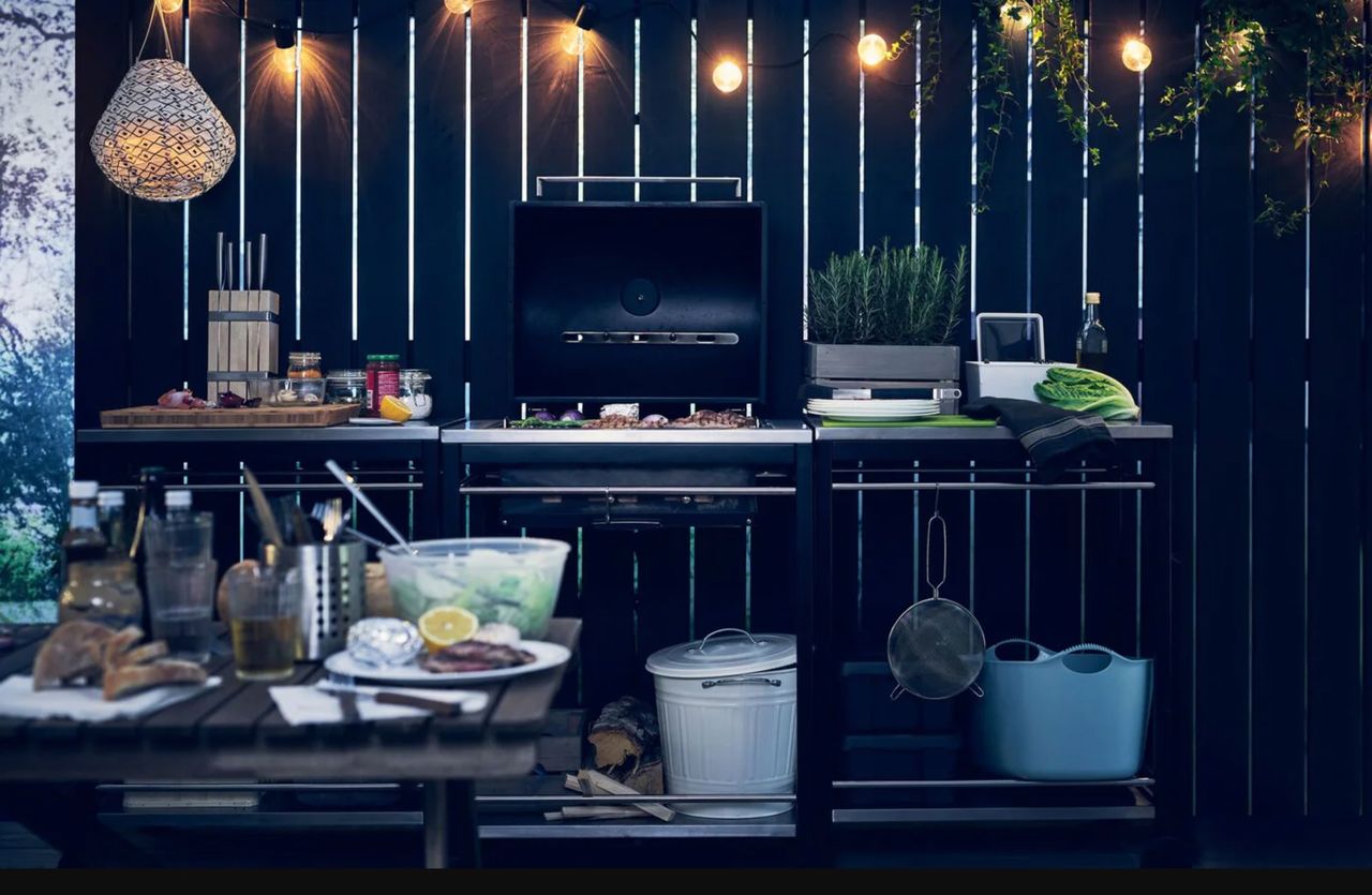 BBQ area with food prep station and festoon lights