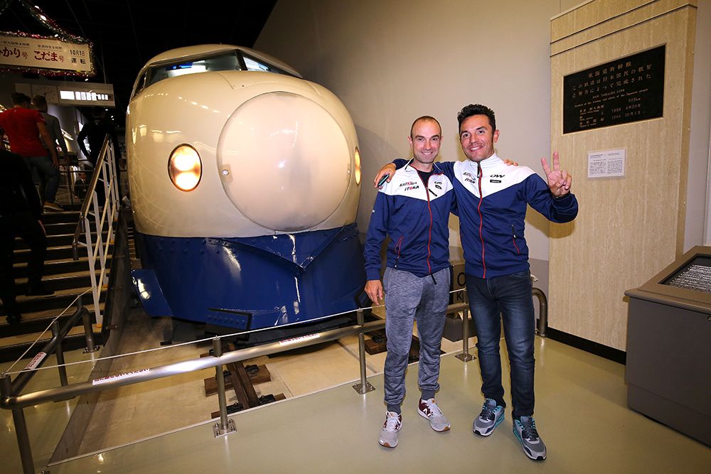 Joaquim Rodriguez and Jacopo Guarnieri pose together in front of an old train