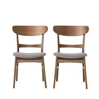 Two dark brown wooden mid-century dining chairs with dark gray upholstery on the seats