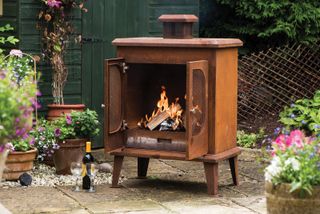 outdoor woodburning fireplace in a rust finish
