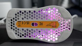 A Glorious Model O Eternal gaming mouse on a mouse mat with the lighting enabled.