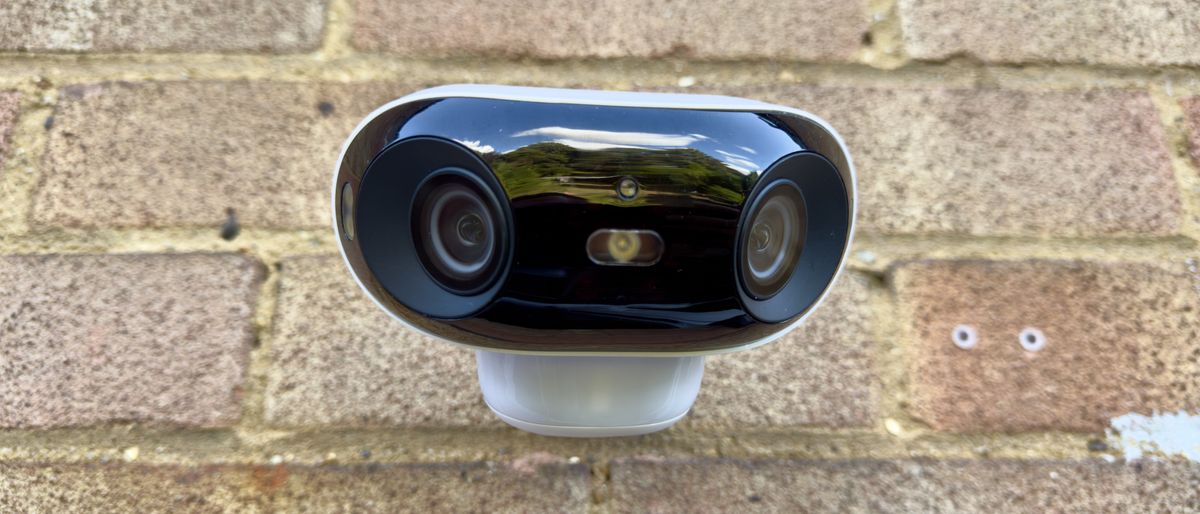 Reolink Argus 4 Pro security camera attached to a brick wall