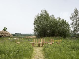 Wooden furniture inspired by Shaker photographed in a garden in the Belgian countryside