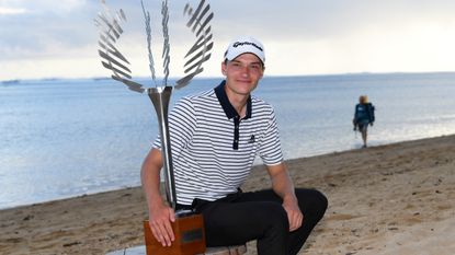 Rasmus Hojgaard with the trophy after winning the 2022 AfrAsia Bank Mauritius Open