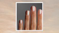 A close-up of a hand with pearlescent nails created by nail artist, Mateja Novakovic (@matejanova) in front of a grey background and in a beige and grey sunset-style template