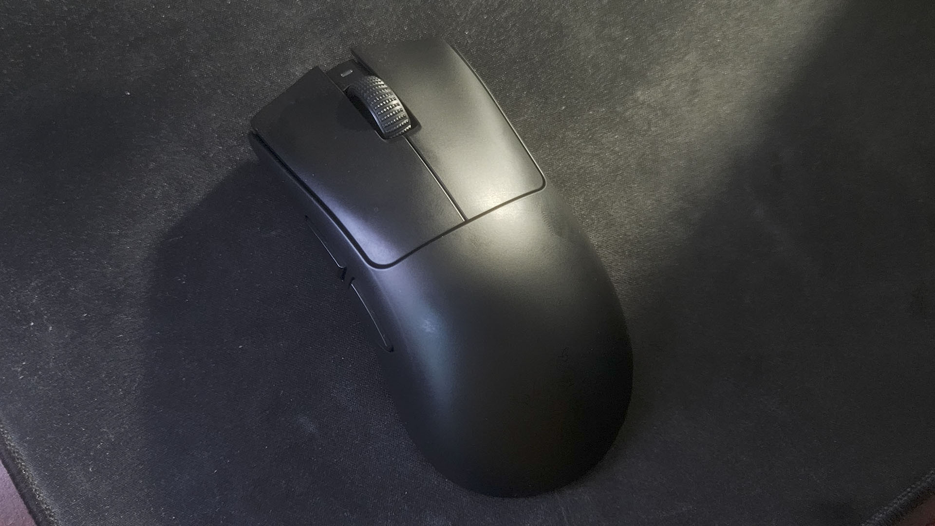 A Razer DeathAdder V4 Pro on a desk
