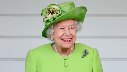 Queen Elizabeth II (wearing her Vanguard Rose Brooch which she received in 1944 from Messrs John Brown and Co. when she launched HMS Vanguard) attends the Out-Sourcing Inc. Royal Windsor Cup polo match and a carriage driving display by the British Driving Society at Guards Polo Club, Smith's Lawn on July 11, 2021 in Egham, England.