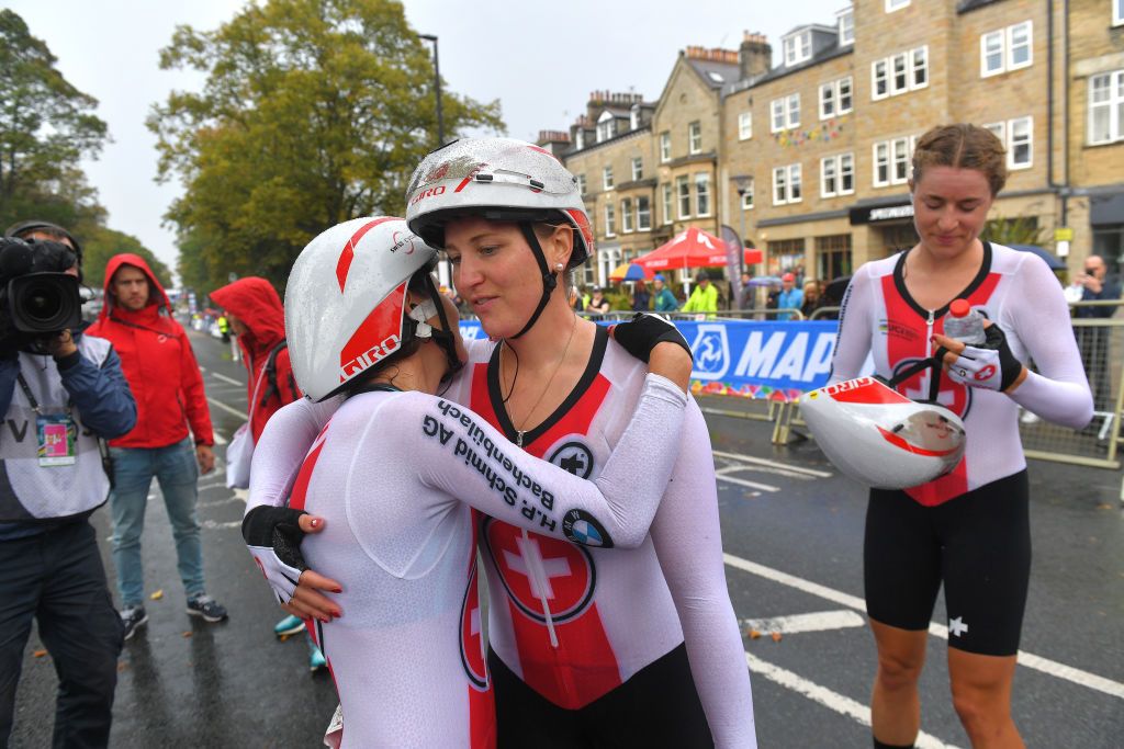 Kathrin Stirnemann (centre) celebrates sixth place at the team time trial mixed relay with Swiss teammates Elise Chabbey and Marlen Reusser at the 2019 UCI Road World Championships in Yorkshire